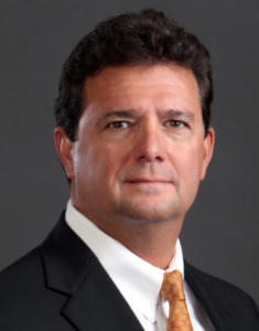 Headshot of Bob Brillante on a grey background